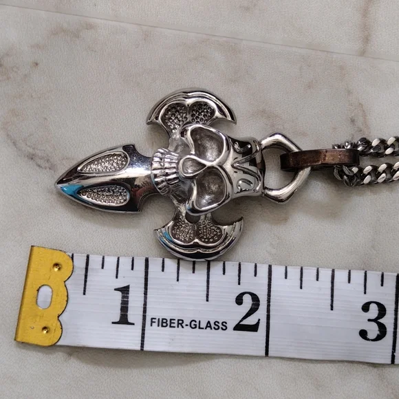 Chisel stainless steel skull pendant and chain necklace.